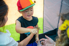 Child holding butterfly