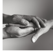 Someone holding someone's hand between their hands.