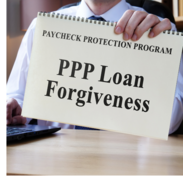 A man holds a notebook that says, "Paycheck Protection Program PPP Loan Forgiveness."
