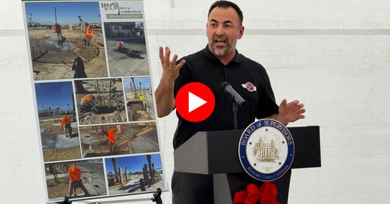Photo of Transportation Director Dennis Acuna speaking at ribbon cutting in Mecca