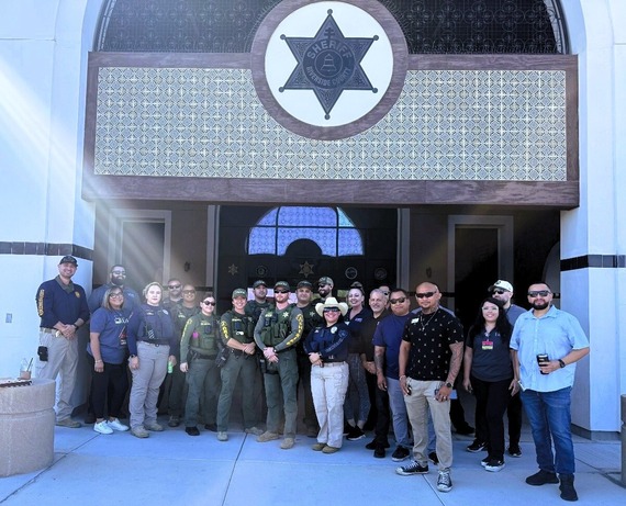 Code Enforcement standing in front of the sheriff station with groups of people from partner agencies