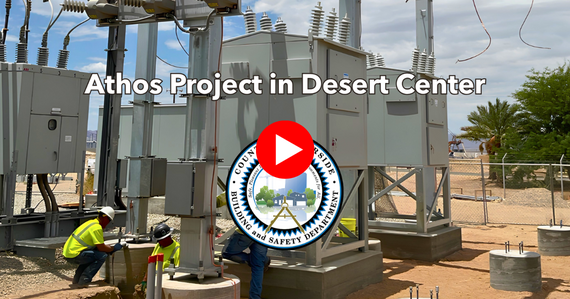 A play button over a photo of the Athos Project in Desert Center 