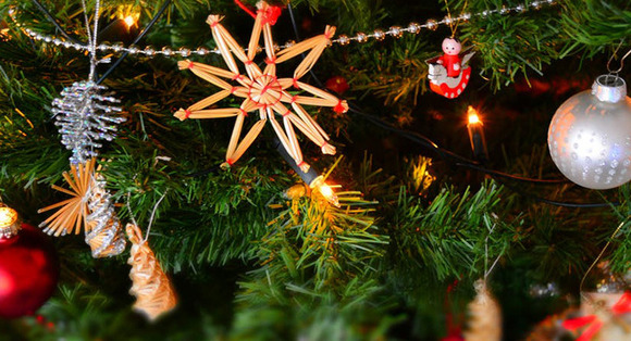 Image of Christmas tree branches with ornaments.