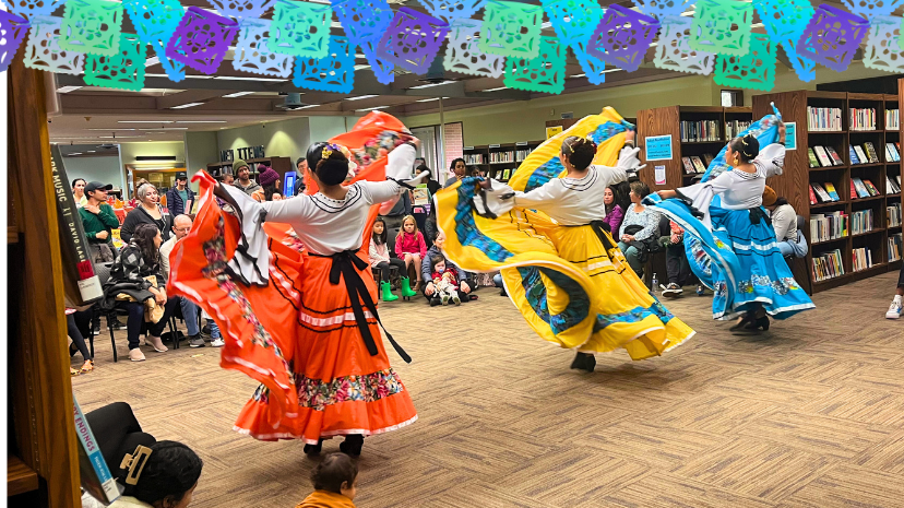 Photo of three women performing Ballet Folklorico in traditional dress