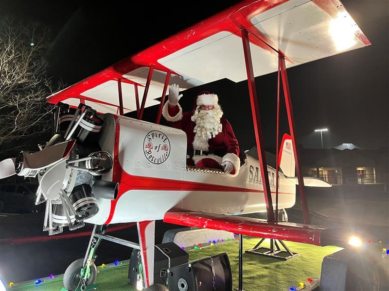 Photo of Neighborhood Santa in an airplane