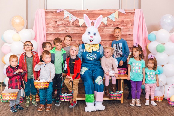 Photo of a group of 11 children with the Easter Bunny
