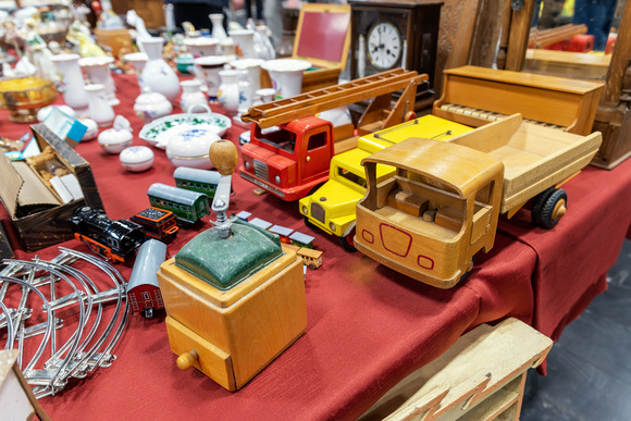 Photo of wooden toy trucks, boxes, and other small figurines
