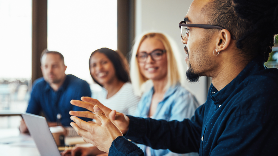 A group of colleagues collaborating at a table
