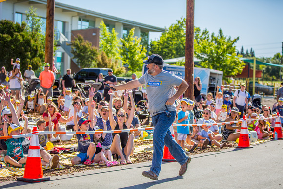 Brayden jogs and waves to the Big Trucks Summer audience