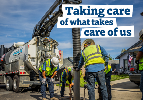 Environmental Utilities field staff work on a hole in the ground. In the top corner of the image, text reads, "Taking care of what takes care of us"