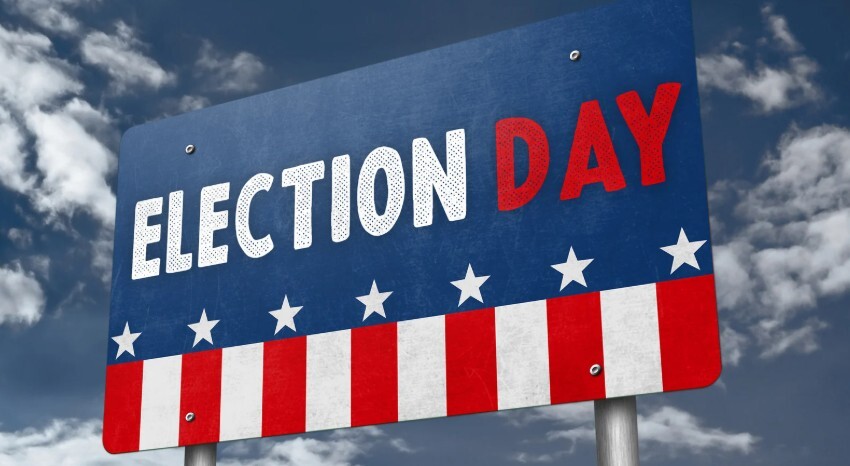 A road sign reads, "Election Day" in red, white, and blue colors.
