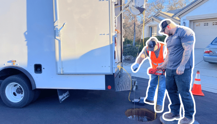 Two Utility workers inspect a site