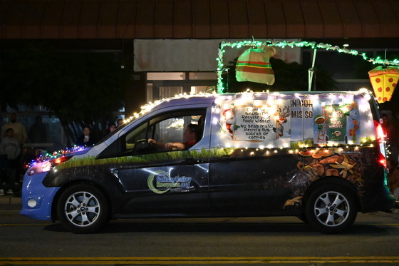 van decorated with lights promoting environmental sustainability