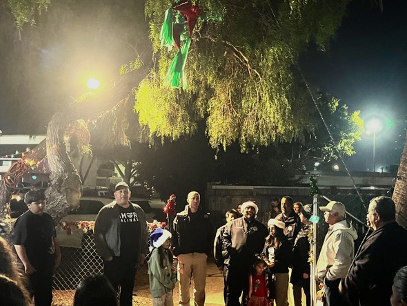 Rene, Jose, and Salinas PD thanking the La Posada Attendees as before they start breaking the piñata.  