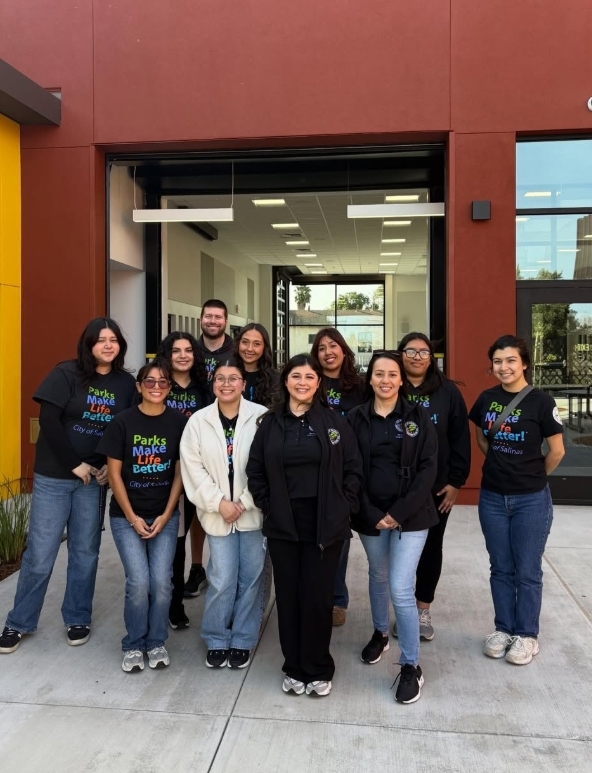 Group standing for photo on grand opening of Hebbron Family Center