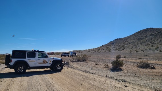 A Sheriff jeep vehicle is seen in the desert landscape.