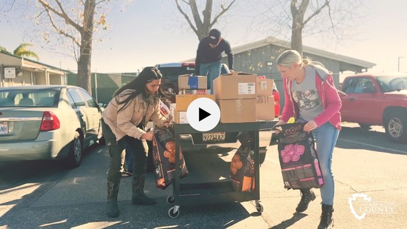 Laura Jones, All About the Animals CEO donates toys and supplies to Devore Animal Shelter