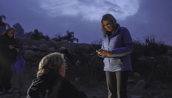 Supervisor Rowe talks to homeless person during the 2024 Point In Time County