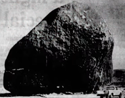 A black and white photo of Giant Rock. 