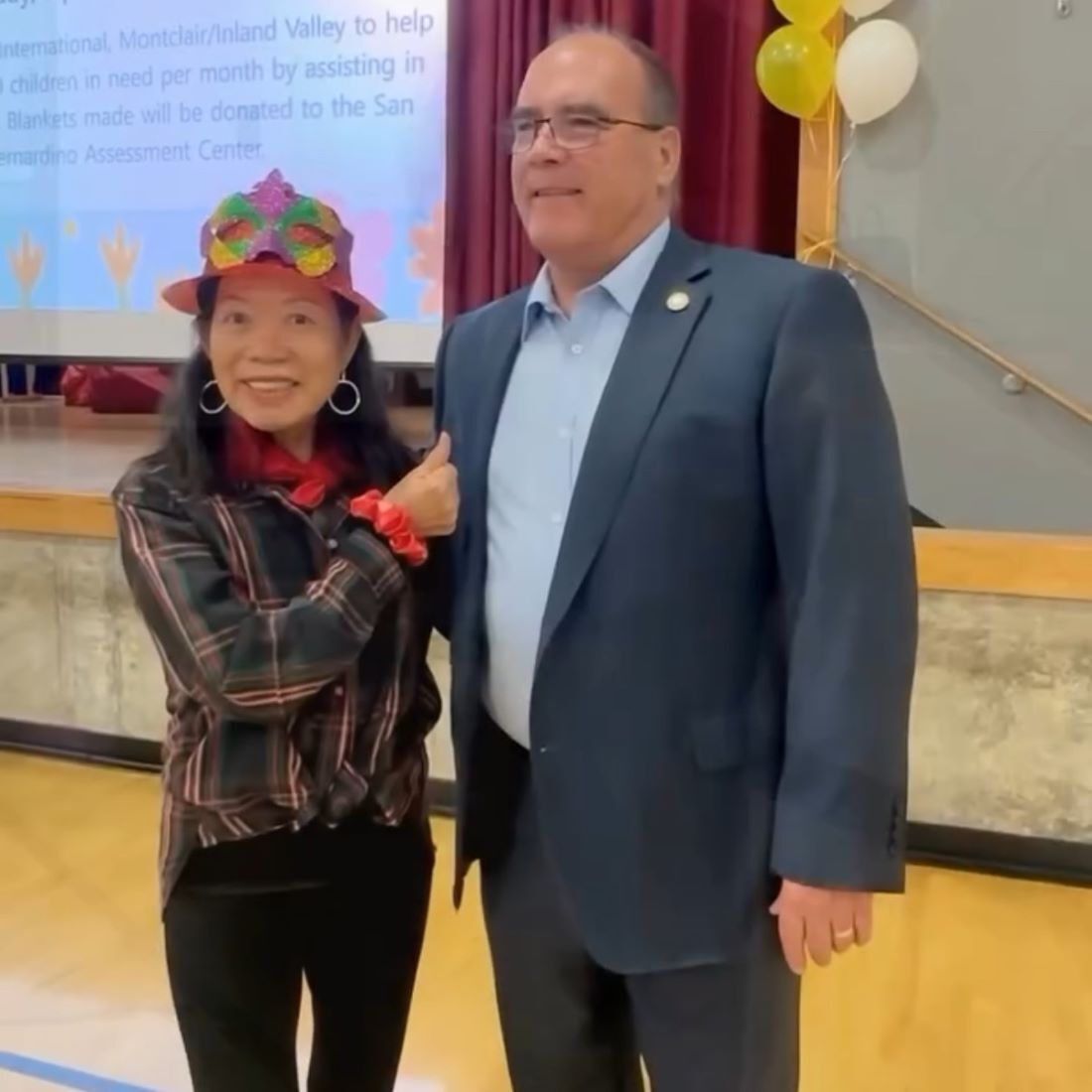 Supervisor Hagman taking a photo with a female at the Montclair Senior Birthday celebration.