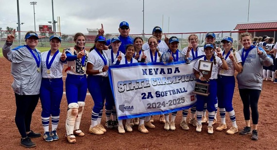 State Champion Needles softball team posing with their trophy