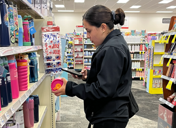 Officer checks the price of a water bottle during a county Agriculture/Weights & Measures Price Scanner Program inspection at a local retail store. 
