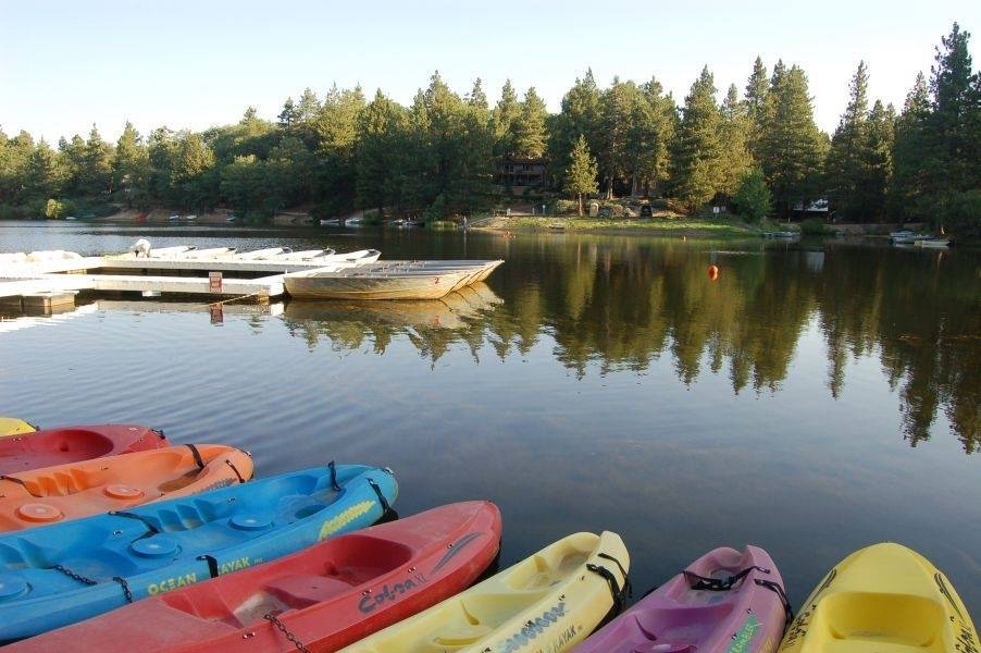 Green Valley Lake in the San Bernardino Mountains. Canoes are seen at a dock, ready to hit the water.