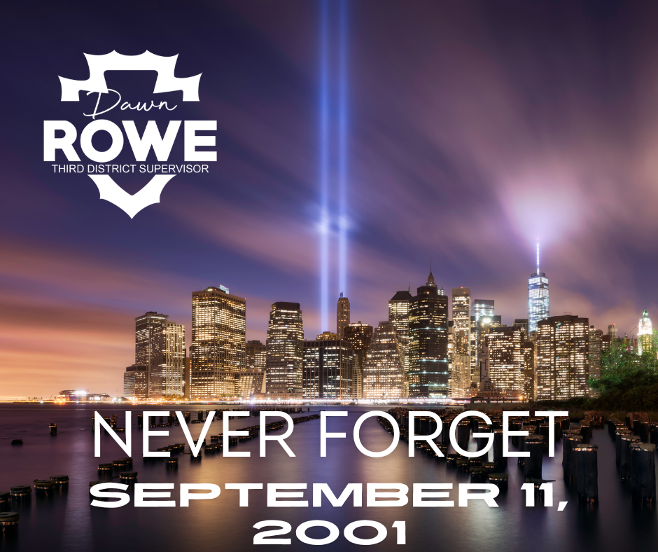 New York City skyline w/2 beams of light shining where Twin Towers were & words Dawn Rowe 3rd District Supervisor Never Forget, Sept. 11, 2001