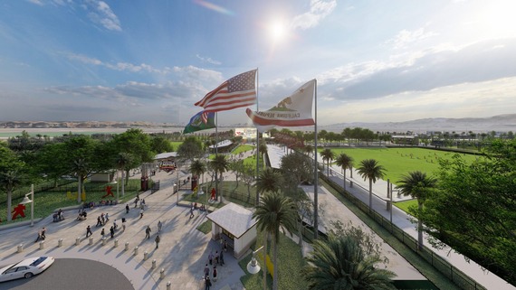 Entrance of Ontario Sports Empire with flags, palm trees, and people walking in.