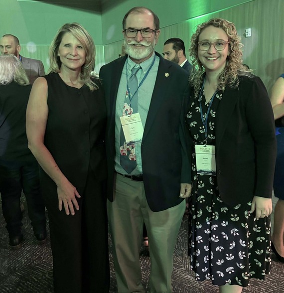 Chris and Kelsey Gubler stand with Chair Rowe at the State of the County afterparty