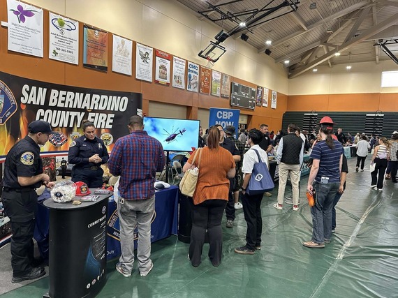 Dozens of job seekers visit the booths of potential employers at the Joshua Tree Job Fair and Resource event held at Copper Mountain College