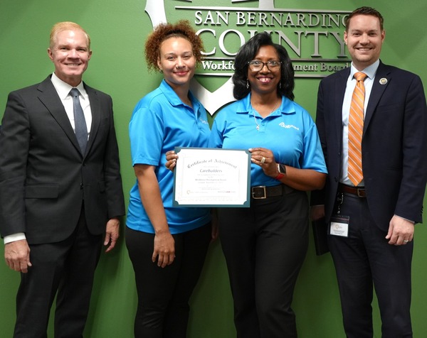 From left, WDB Chair William Sterling, Charmayne Keys and Sheila Jones-Lilley of CareBuilders and WDB Director Bradley Gates