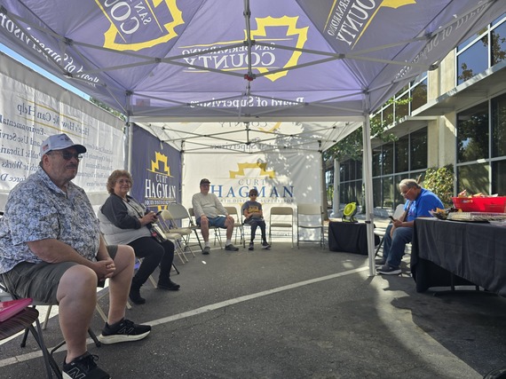 San Bernardino County Veterans sitting under a Curt Hagman Fourth District canopy during the 2025 Veteran Claims Event.