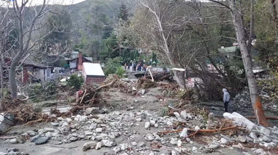 Shows post-flooding damage in the community of Lytle Creek, California