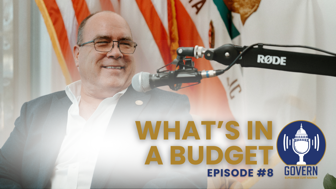 Supervisor Hagman speaking into a podcast microphone with title "What's In A Budget?" Episode 8 of Govern podcast.