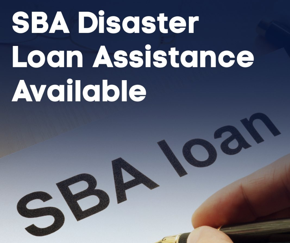large white text “SBA Disaster Loan Assistance Available” on blue background with hand holding pen signing document, with words “SBA loan”