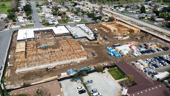 Aerial view of a construction site in a residential area. 