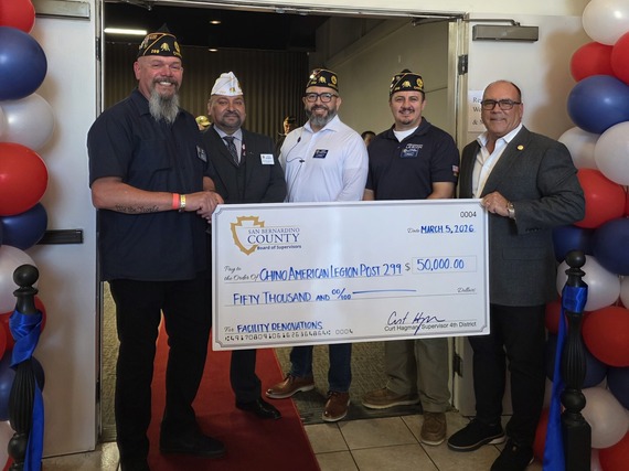 Supervisor Hagman presents a $50,000 check to the Chino American Legion Post 299. 