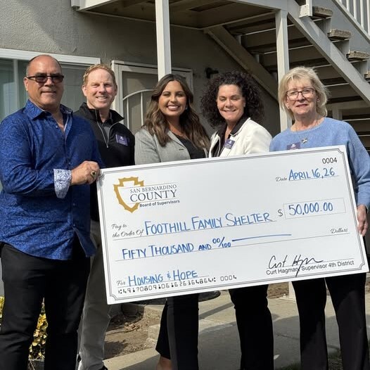Supervisor Curt Hagman and Foothill Family Shelter staff pose with a $50,000 San Bernardino County check supporting housing and support services.