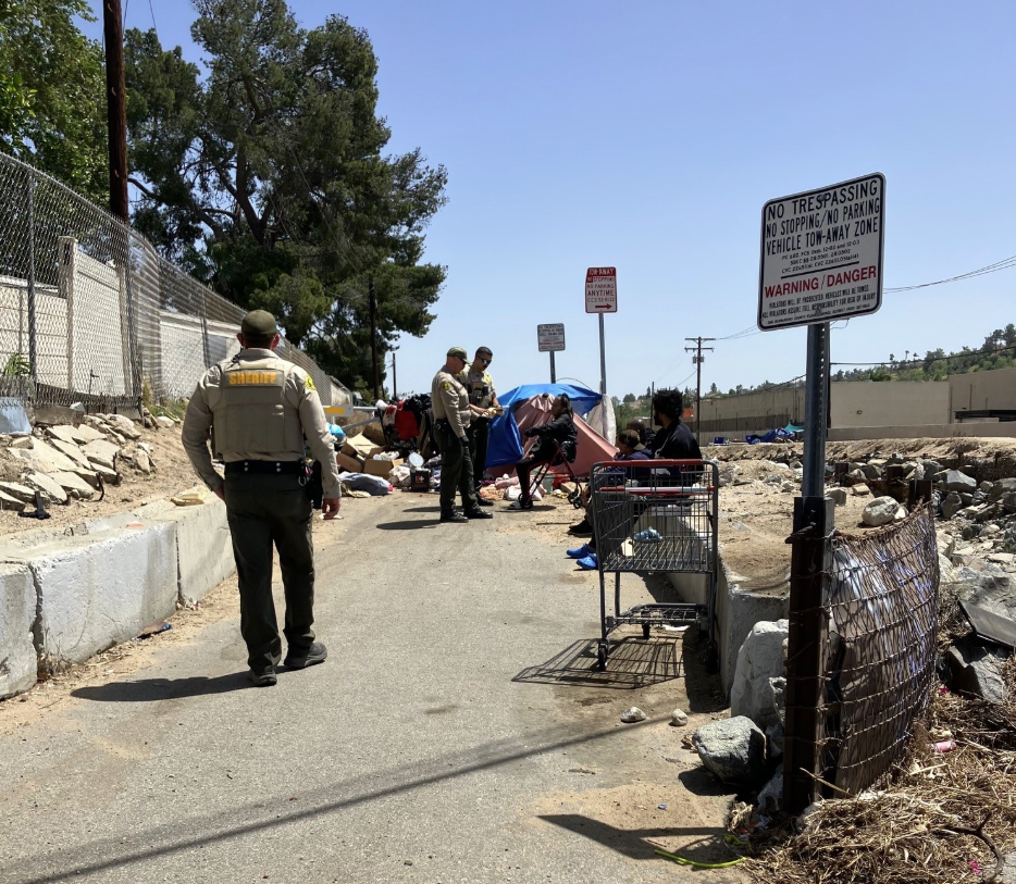 Members of the San Bernardino County Sheriff's Department work with the homeless population in Loma Linda.