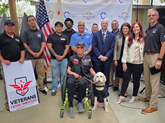 Veterans Legal Institute staff, veterans, county representatives, and community members pose for a group photo.