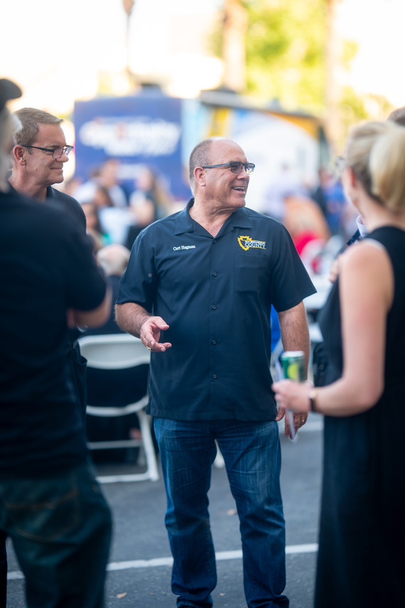 Supervisor Curt Hagman speaks with attendees during his 2026 Annual Summer Open House in San Bernardino County.