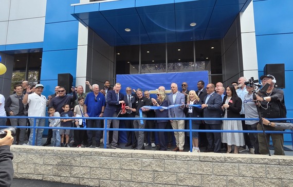 Community leaders, guests, and Orel Hershiser celebrate the dealership ribbon-cutting in Chino