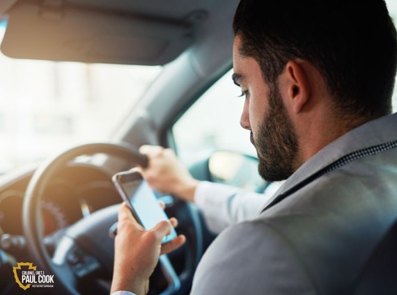 Man on cell phone while driving