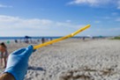 Beach cleanup with a straw