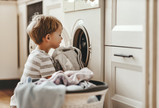 boy at clothes dryer