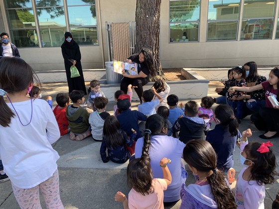 Lorena does storytime at dia de los ninos