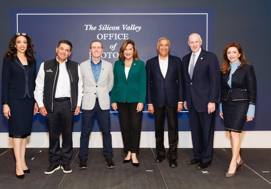 Mayor Lisa Gillmor with a group of business professionals.