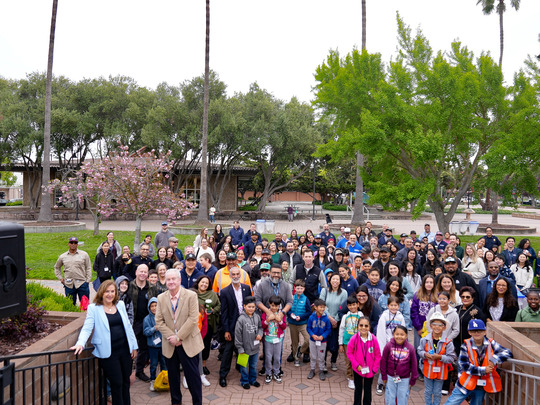 Mayor Gillmor and group of people outside City Hall