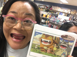 A woman with glasses smiling
